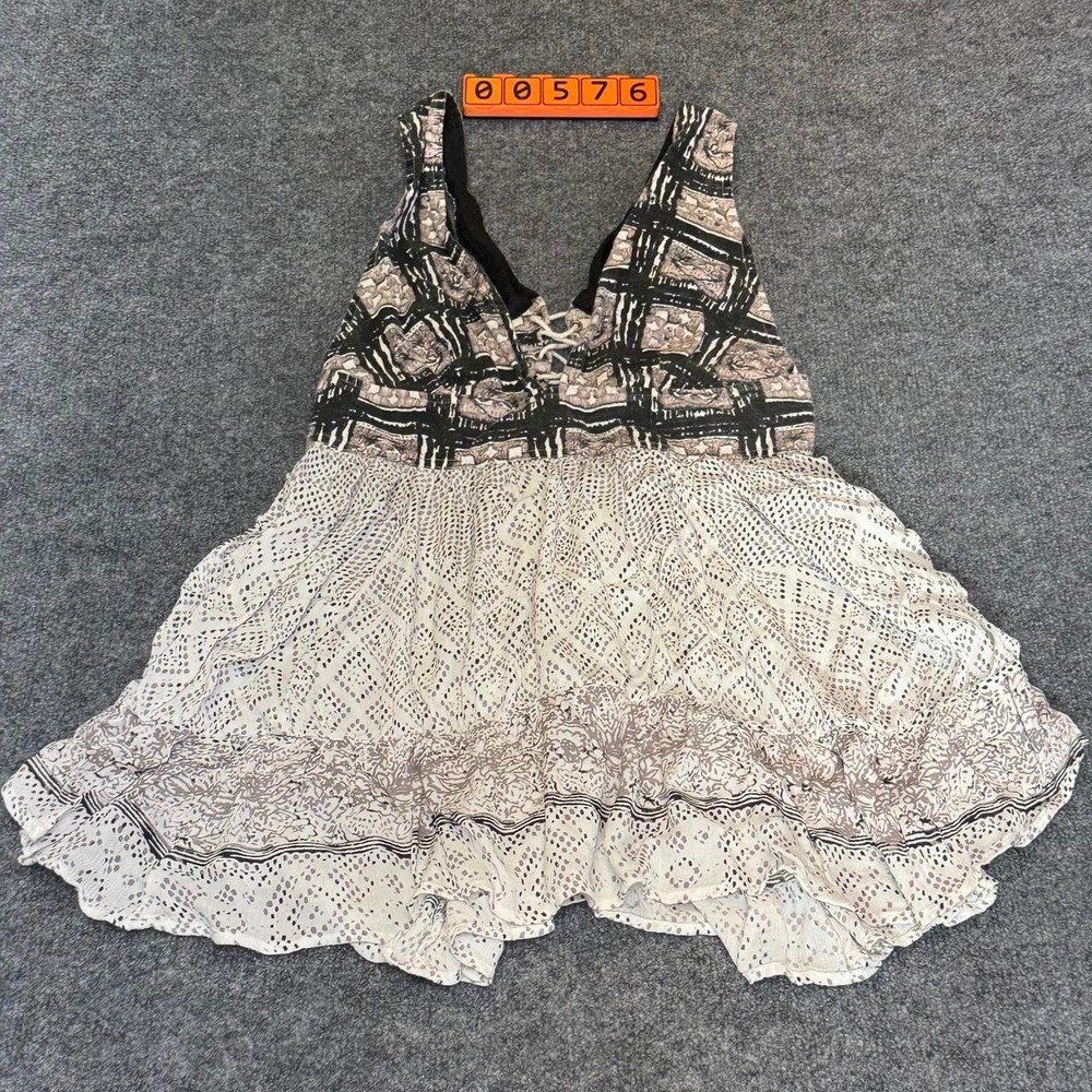 Free People Y2K style white & black lace top with ruffles and lace up detail.